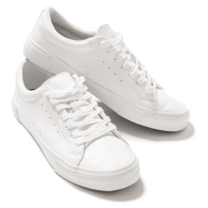 Women’s minimalist white sneaker on a clean studio white background