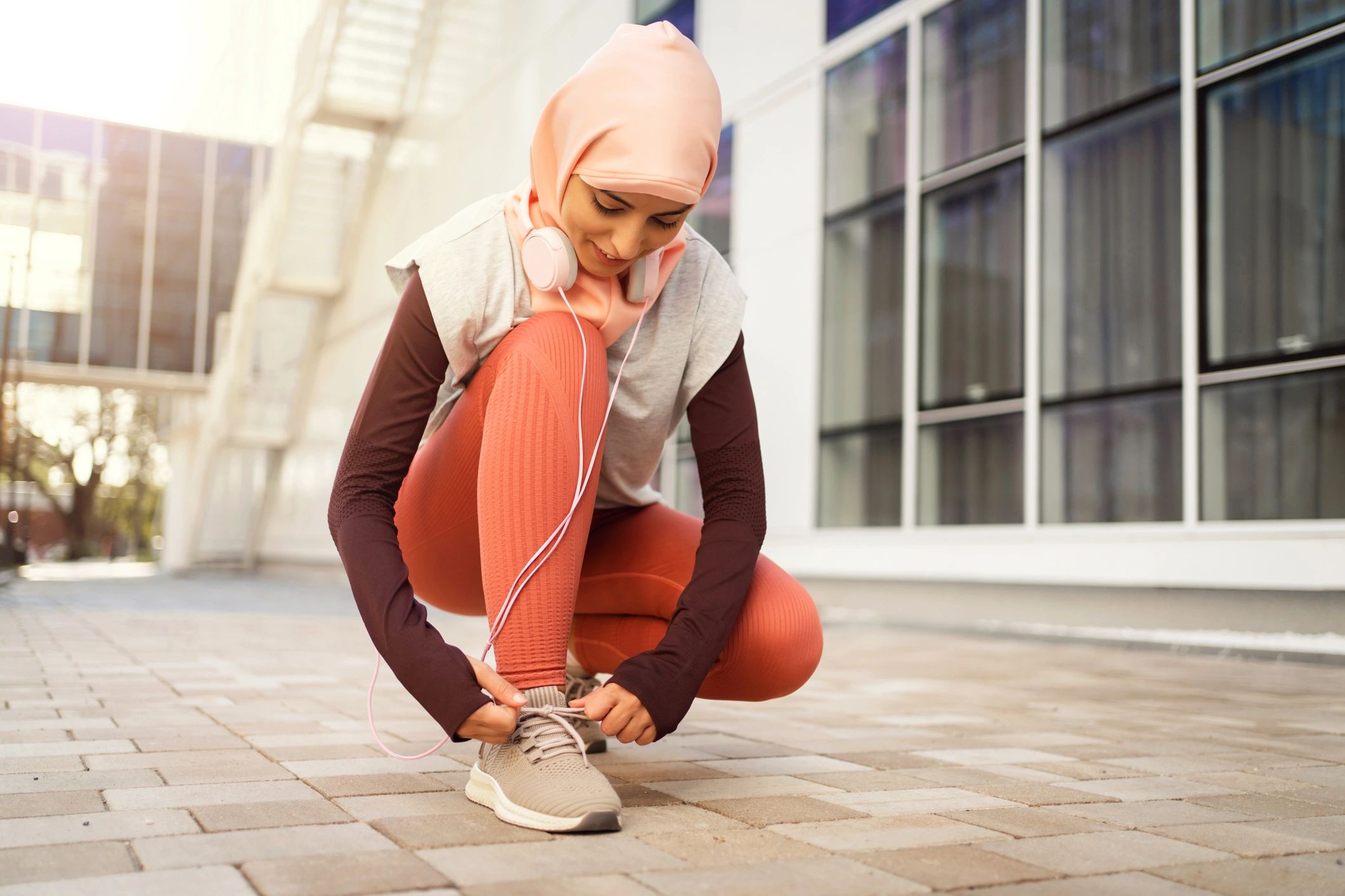 Person tying sneakers before heading out