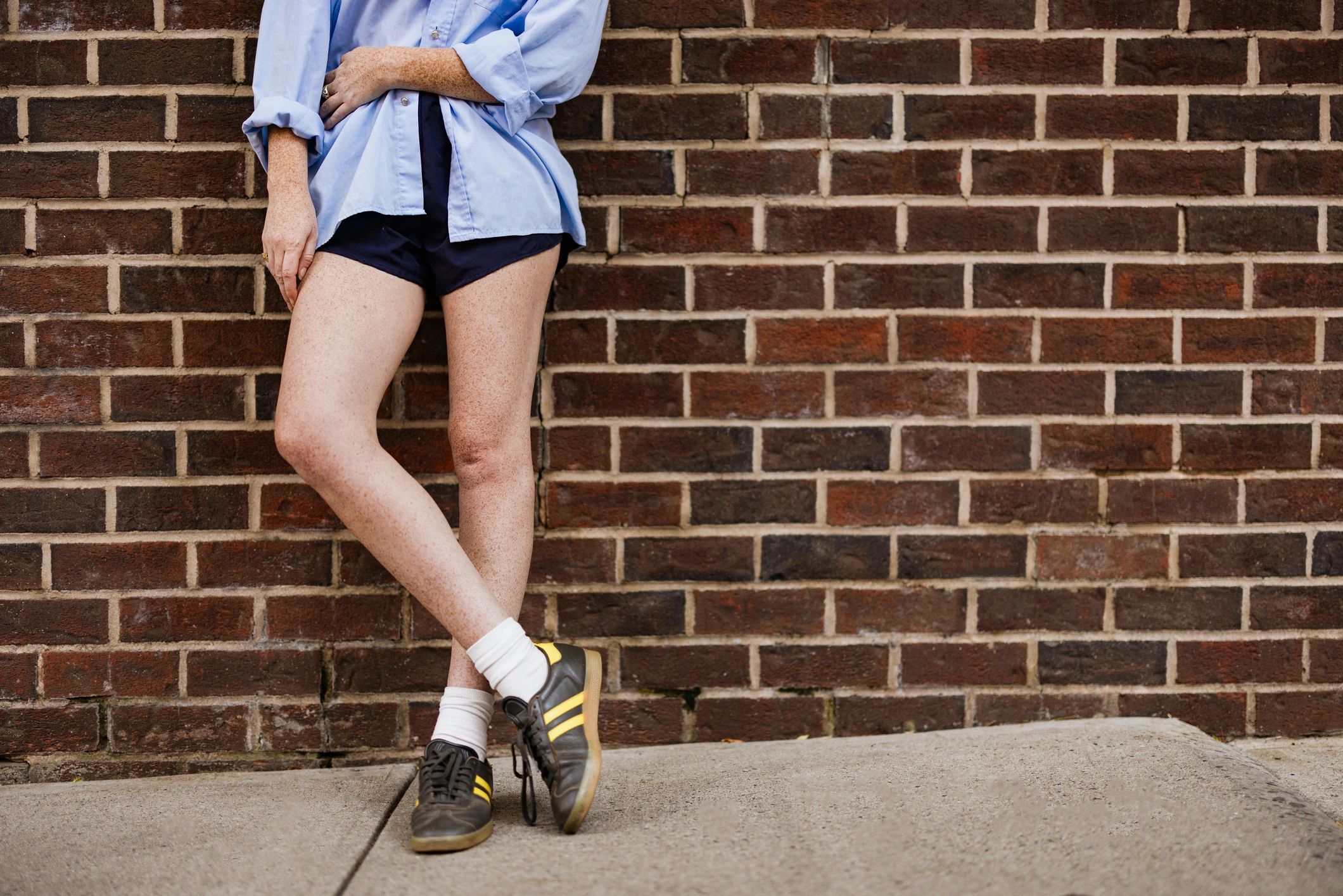 Customer wearing sneakers in an urban setting
